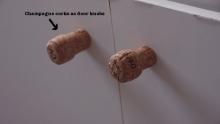 Using champagne corks for door knobs, looks good and easily replaceable if they break or get dirty