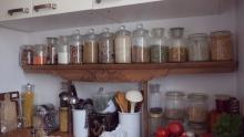 This kitchen shelf used to be the top of a closet Shabnam found on the streets. Now it carries her bulk bought grains